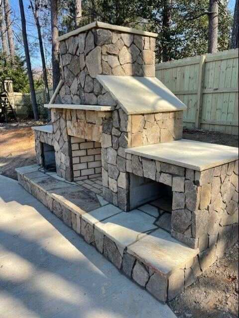 Custom stone outdoor fireplace design Georgia