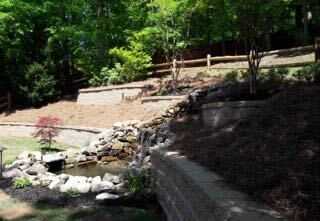 Tiered stone retaining wall water feature Georgia