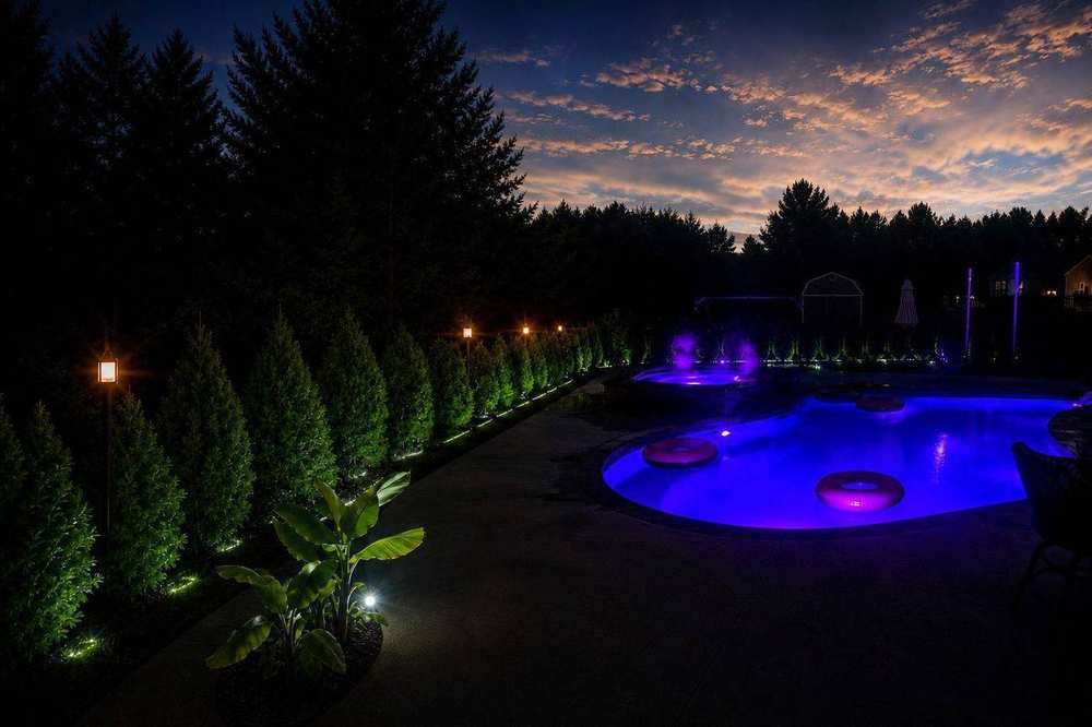 Pool maintenance Georgia — New Life Outdoors luxury inground pool with LED lighting at night